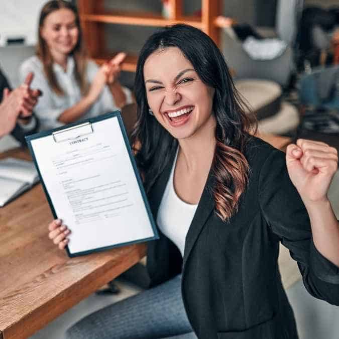 Excited professional celebrating a successful job offer with an ATS-friendly resume template.